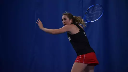 Katie Day hits a forehand