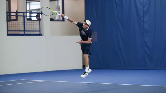 Ruadhan O'Sullivan hits a serve