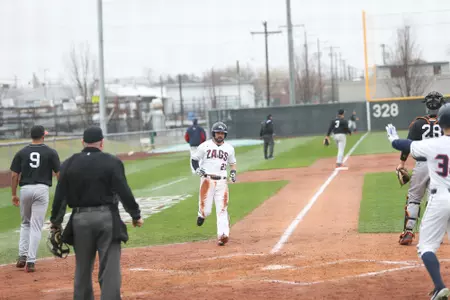 Austin Pinorini cross home plate