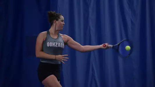 Taylor Gruber hits a forehand