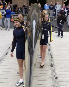 The GW women's rowers carry a shell before their race in the 2004 Crew Classic.  Both the GW men and women will be in action Saturday on the Potomac River.
