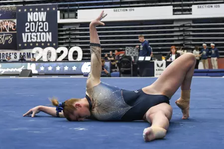 Raymond competes on floor.
