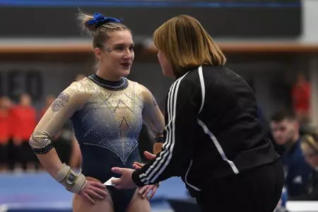 Banen talks to Foster-Cunningham before beam routine.