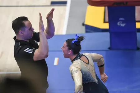 Crasa celebrates her vault.