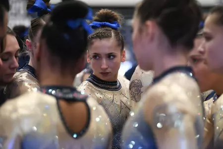 Olivia Zona focuses in on team huddle.