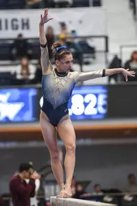 Zona competes on beam.