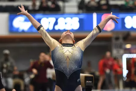 Zona presents after competing on beam.
