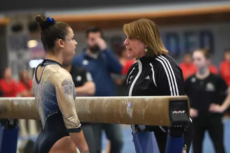 Karpova competes on beam.