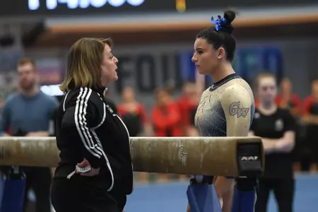 Crasa prepares to compete on beam.