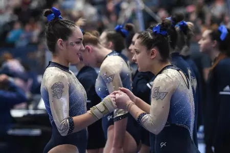 Munnelly and Karpova fist bump.