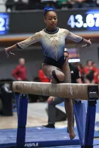 Chambliss competes on beam.