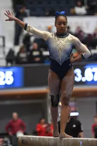 Chambliss competes on beam.
