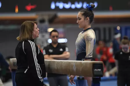 Munnelly prepares to compete on beam.