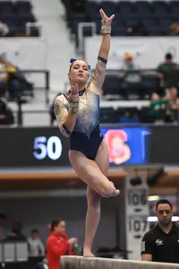 Munnelly competes on beam.