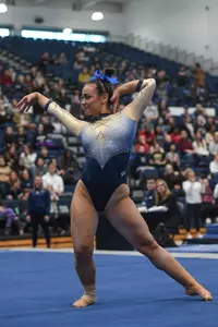 Kaplan competes on floor.
