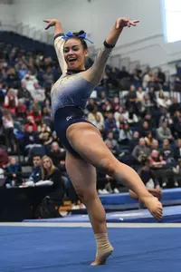 Kaplan competes on floor.