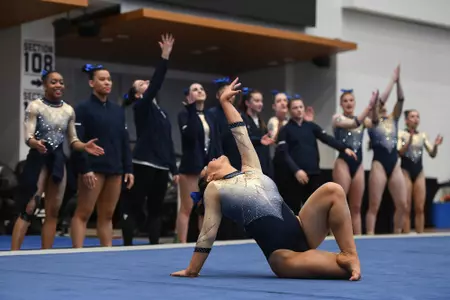 Kaplan competes on floor.