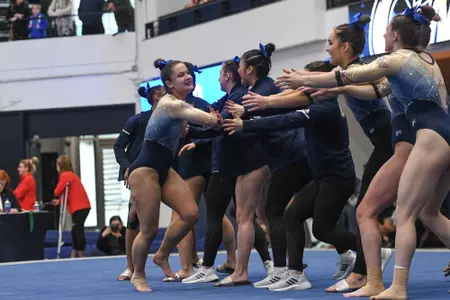 Karpova celebrates after competing on floor.