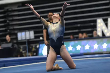 Raymond competes on floor.
