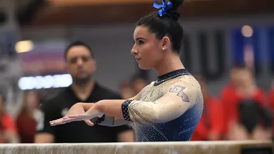 Cydney Crasa prepares to compete on beam.