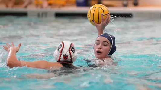 Juliette Belanger searches for a pass.