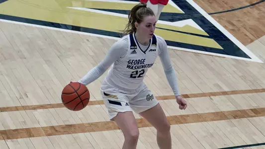 Maddie Loder dribbles down the court