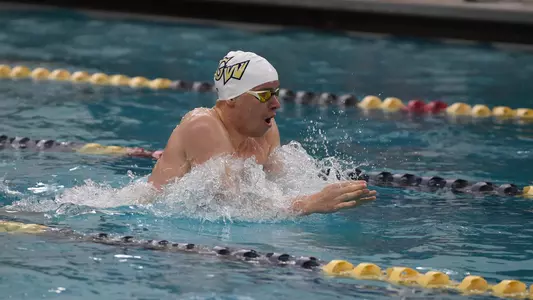 Marek Osina swims breaststroke vs. Virginia Tech.
