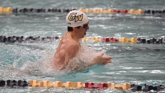 Bode Ringenbach swims breaststroke vs. Virginia Tech.