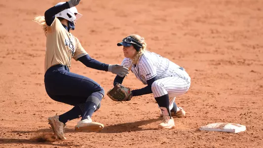 Hannah Eslick puts down a tag.