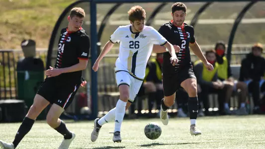 Carter Humm dribbles through traffic vs. Davidson.