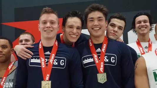 Marek Osina, Karol Mlynarczyk, Tyler Kawakami and Durde Matic pose with their gold after the 200 medley relay.