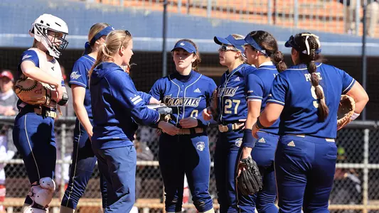 Head Coach Chrissy Schoonmaker talks with her team.