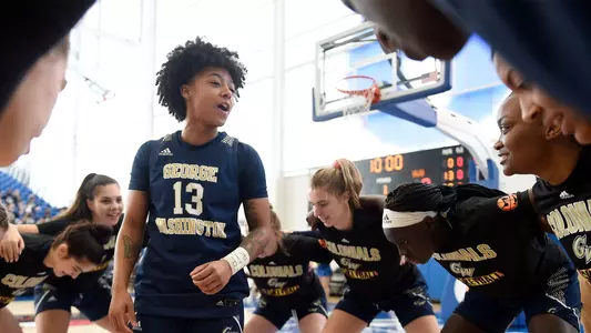 Kyara Frames leads a huddle before the A-10 Championship game vs. La Salle.
