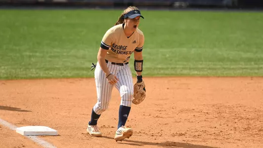Maggie Greco celebrates at third base vs. Georgetown.