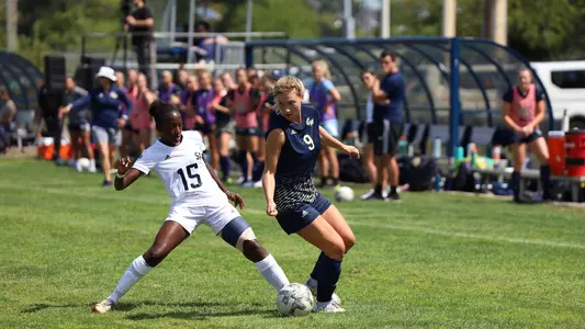 Margaret Rabbitt dribbles around a Saint Peter's defender