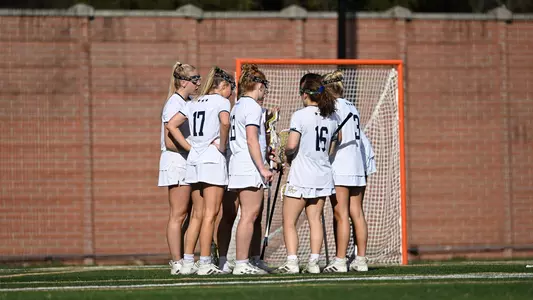 Lacrosse huddles in season opener vs UMBC