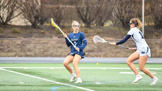 Kiki Rotay looks to pass the ball vs Monmouth