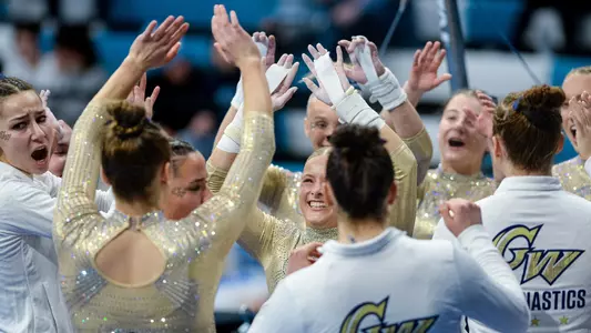 Kasey Burke celebrates the end of her bar routine at UNC