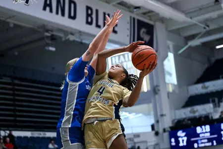 Sara Lewis Extends of a Saint Louis Defender for the Layup