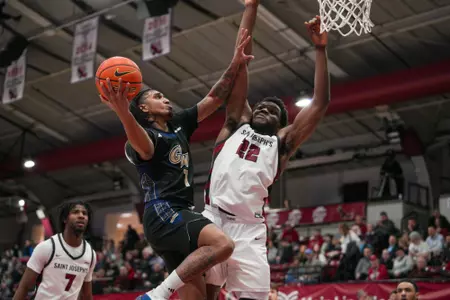 Jean Aranguren attempts a layup at Saint Joseph's