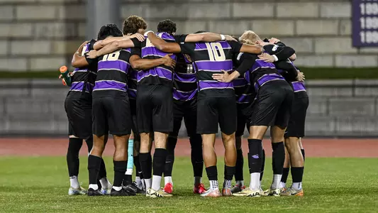 Men's soccer huddle vs. GSU