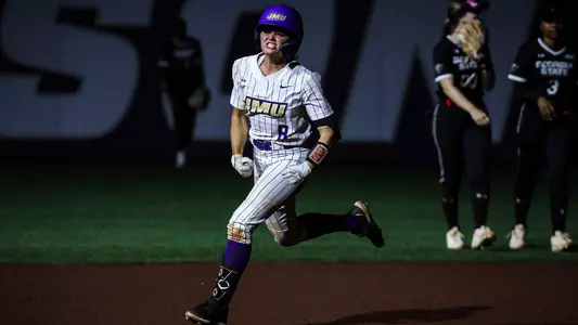 Bella Henzler celebrates go-ahead home run against Georgia State