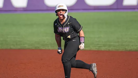 Kira Ortega celebrating a home run