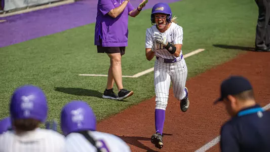 Emma Jo Evans celebrating a home run