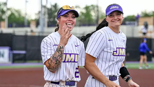 JMU Softball's Payton List and Cali Legzdin celebrating win