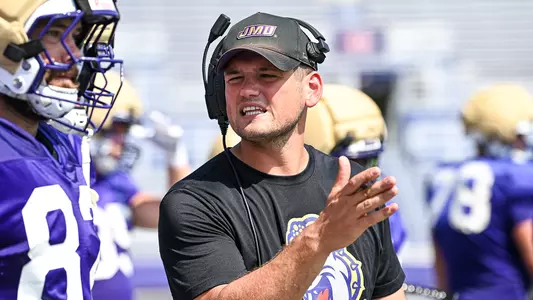 Bryan Schor coaches the tight ends during a JMU football practice
