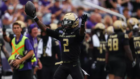 Jayden Mines celebrates after recovering a fumbled punt return against Wagner