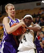 Kansas State's Brie Madden battles for the ball with Christelle N'Garsanet during the first half.