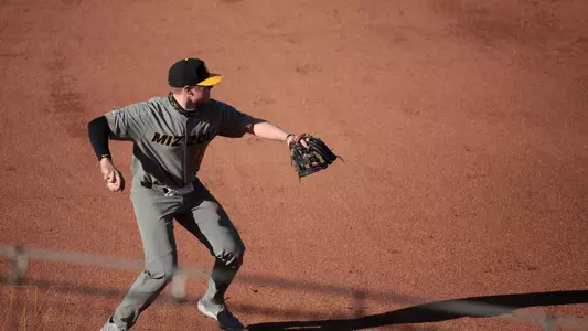 Luke Mann throws across the diamond