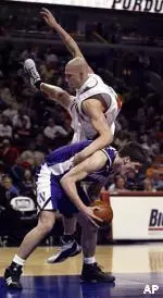 Davor Duvancic is fouled by Illinois' James Augustine